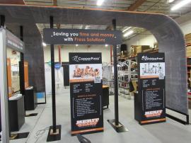 Custom 20 x 15 Island Exhibit with Curved Arches with Pillowcase Graphics, Demo Counters, (4) Monitor Mounts, Stem Lights, Header Signs, and Backlit Graphics