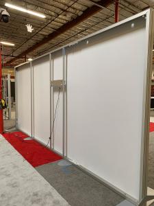 RENTAL: 18" Wide 8 ft. High Backwall with Boomerang Baseplates, Large Monitor Mount, 50" Monitor, SEG Backlit Fabric Graphic -- View 3