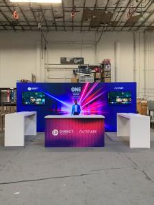 RENTAL: RE-2110  Inline Design with 232" Wide x 96" High Single-Sided Lightbox with Fabric Blocker Panel and Boomerang Baseplates, (2) Large Monitor Mounts, (2) 50" Monitors with HDMI Cables, (2) RE-1579 Genius Bars with White Laminate Finish, RE-1207 Lar